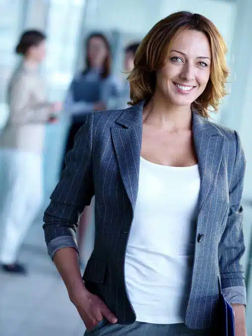 Confident young business woman looking at the camera